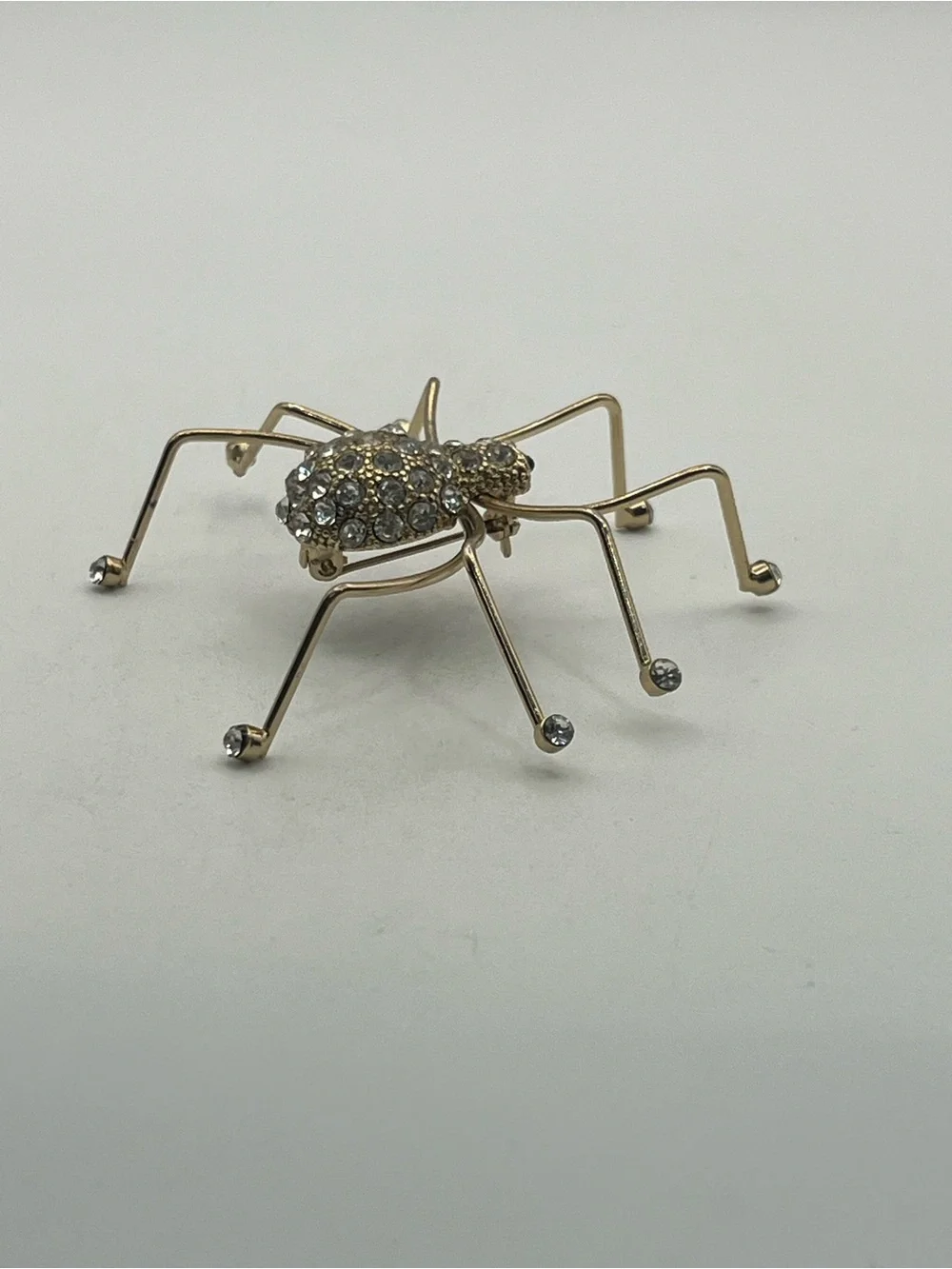 Spider insect gold tone clear rhinestone brooch pin